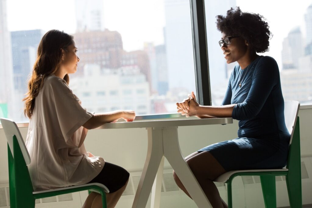 Women sitting down together in an interview setting